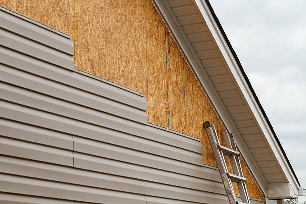 Professional Fiber Cement Siding technician working in Baldwin, NY